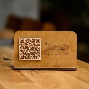 Scan to pay stand with QR code for contactless payment.